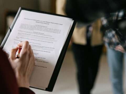 Canadian entrepreneur preparing documents for a business loan application